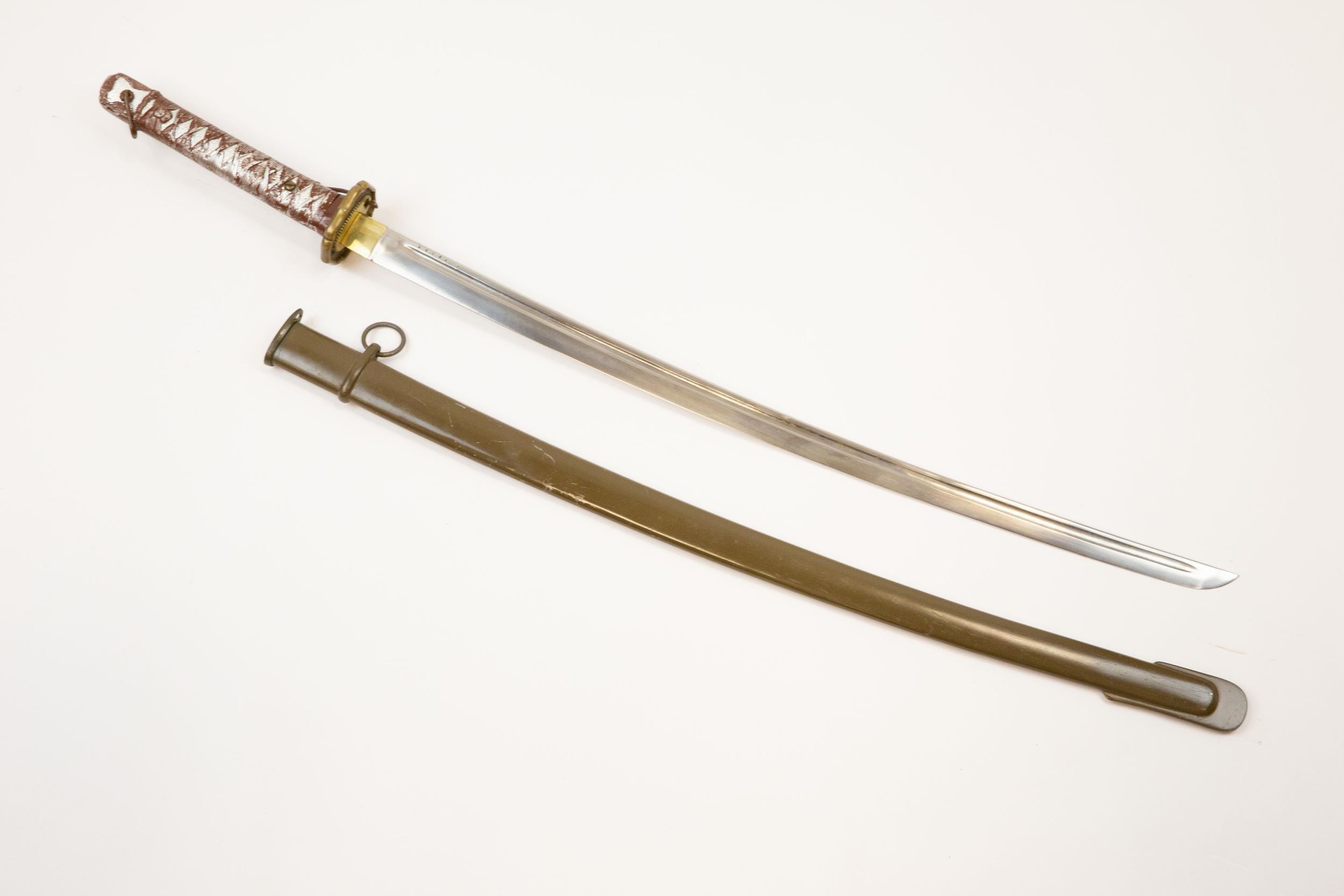 A WWII Japanese NCOs sword, fullered blade 27½", with brown painted aluminium hilt and brass
