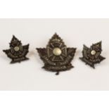 WWI CEF cap badge of the Canadian Chaplains Service, with tangs, and a matching pair of collar