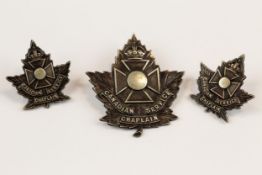 WWI CEF cap badge of the Canadian Chaplains Service, with tangs, and a matching pair of collar