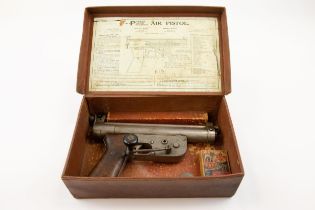A rare .177" Parker Patent Precision crank wound air pistol, number 262, with plain walnut grips.