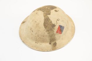 A British WWII Mk 2 steel helmet, the skull with textured desert camouflage finish and painted Royal