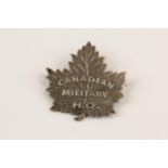A Canadian officer's pin back silver badge of the Canadian Military H.Q., GC. Although Charlton