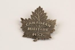 A Canadian officer's pin back silver badge of the Canadian Military H.Q., GC. Although Charlton