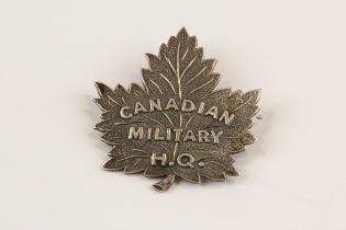 A Canadian officer's pin back silver badge of the Canadian Military H.Q., GC. Although Charlton