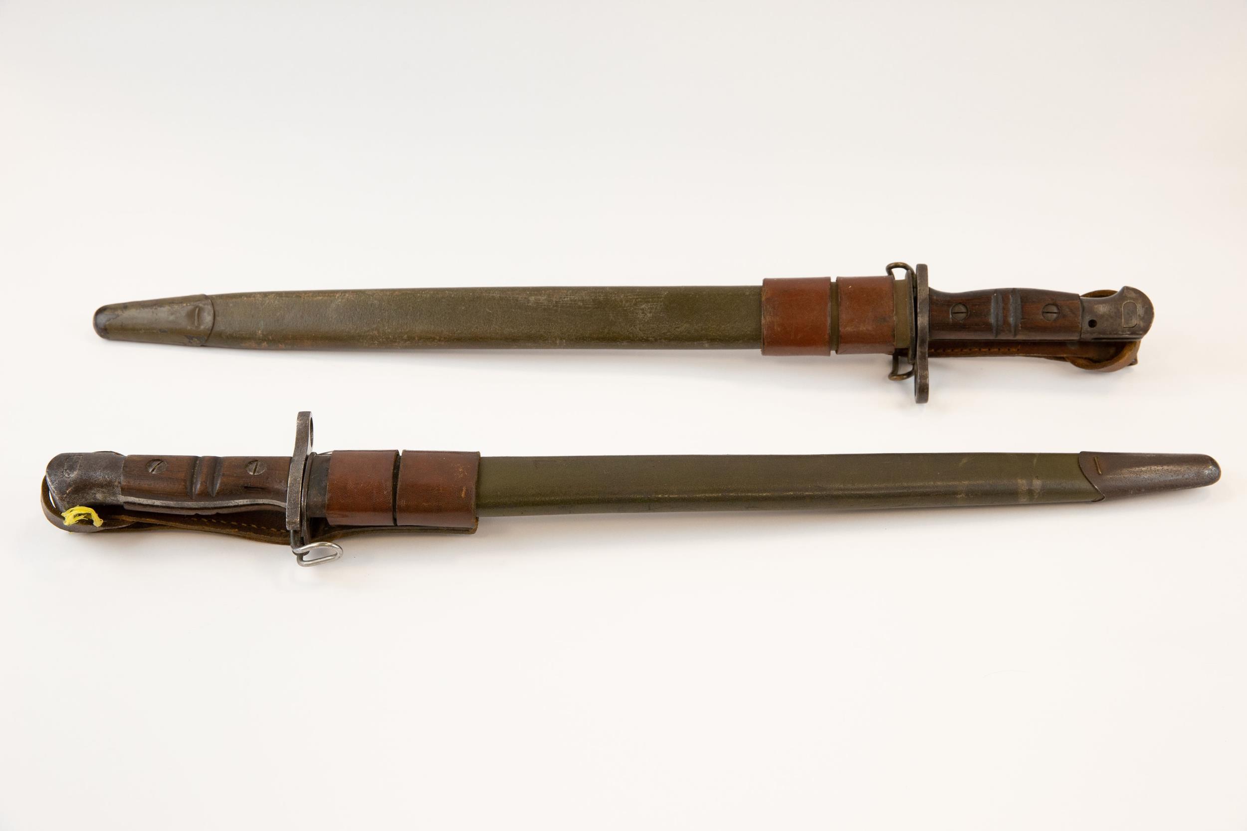 2 US P17 bayonets, complete with frogs, GC (a little external pitting). £120-140