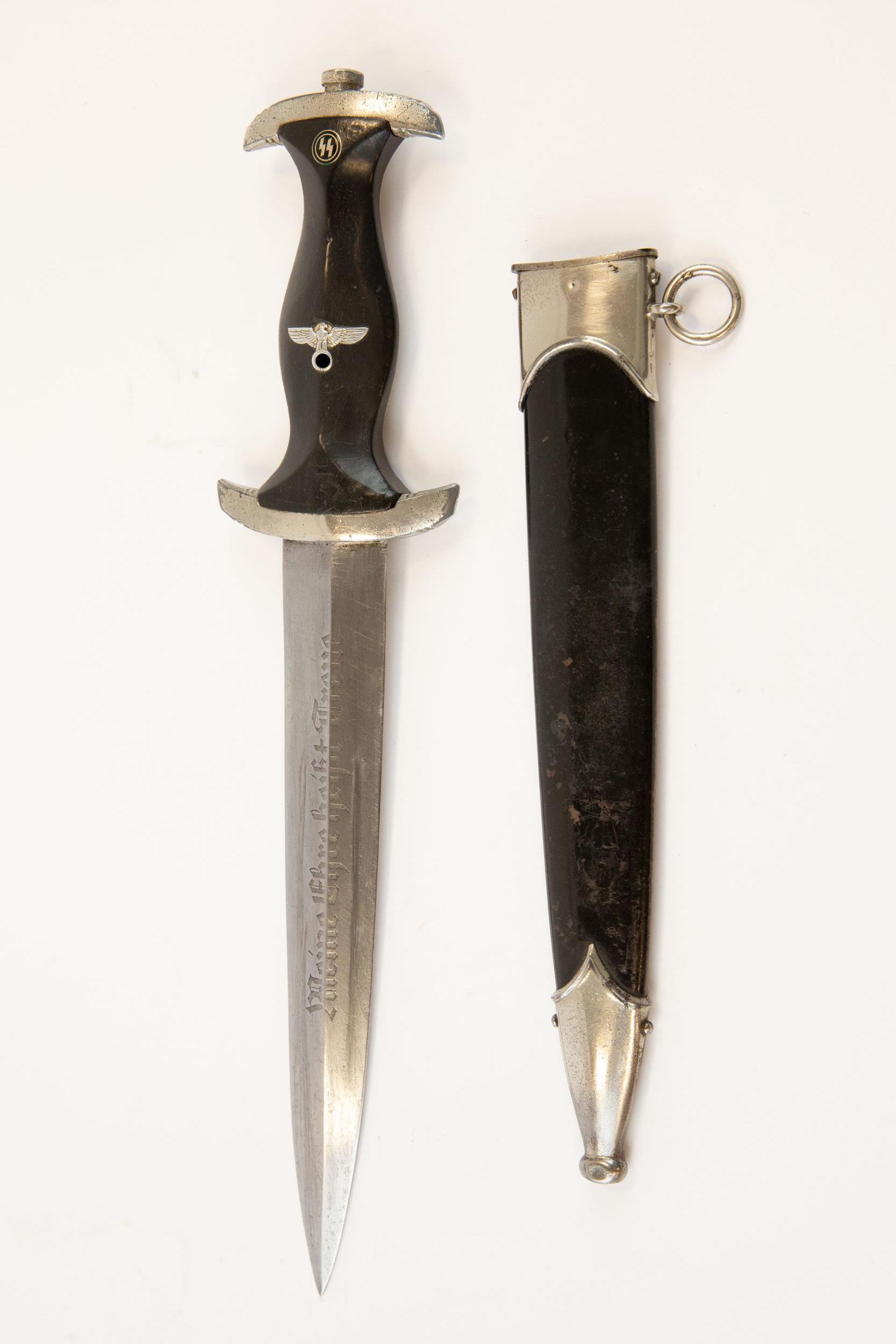 A Third Reich 1933 model SS dagger, the blade etched with RZM and SS marks and "M7/67 1940" (