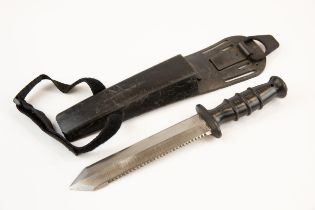 A British Navy issue diver's knife, saw back blade 8", the black rubber hilt embossed "N5 No4220/