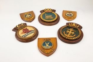 Five painted cast metal ships' plaques: "Sea Devil", "Eskimo", "Rocket", "Woodbridge Haven" and "