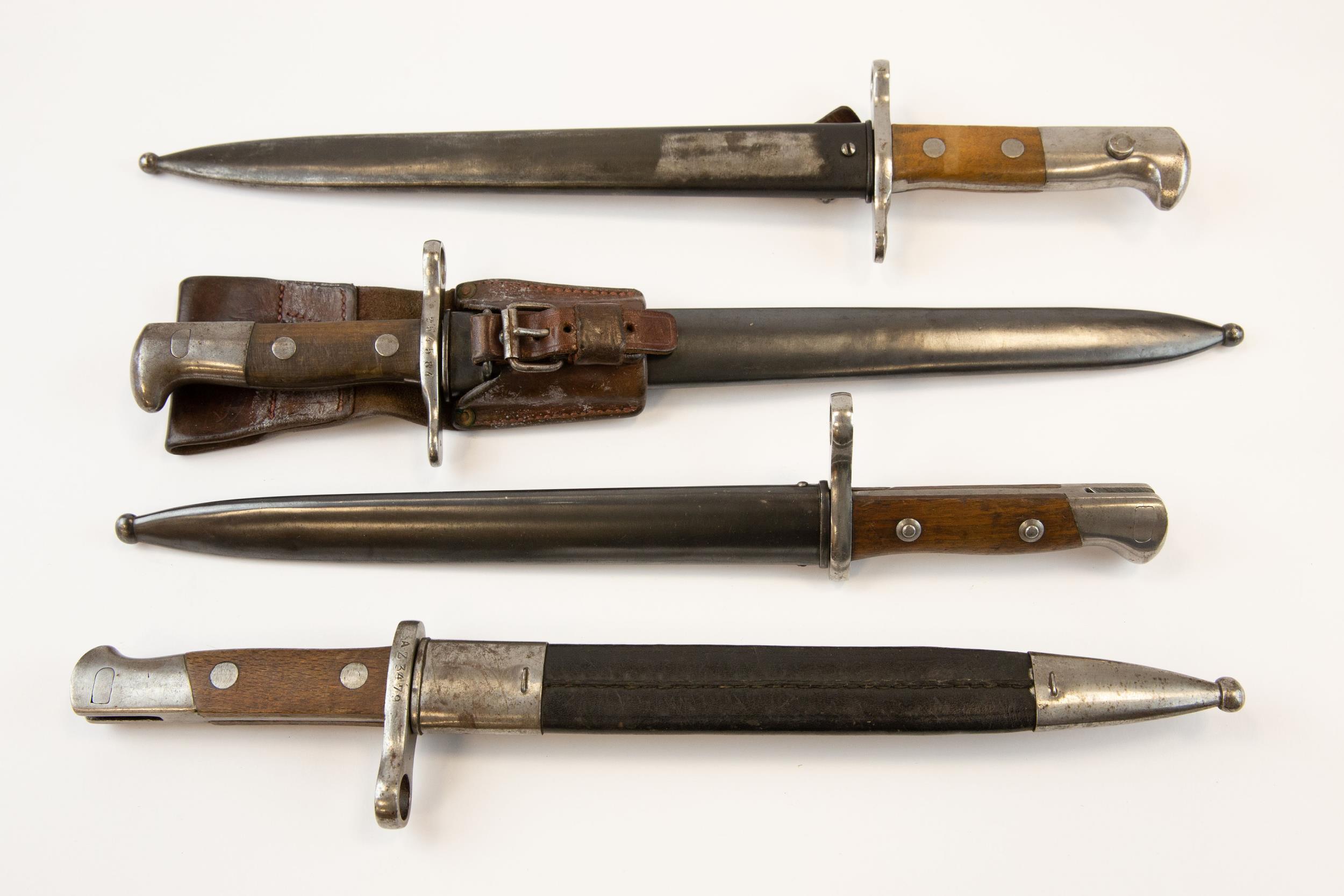2 Spanish Mauser bayonets M1893, one scabbard leather, 1 steel. 2 Schmidt Rubin Swiss bayonets,