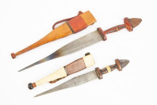 2 African knives with leather covered hilts and scabbards. VGC £30-40