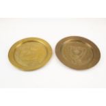 Two WWII Afrika Korps souvenir brass plates, 10" diameter, one embossed and punched "Afrika 1941-