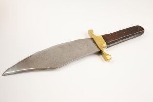 A massive Bowie knife, blade 11" x 3½", etched "Warranted Sheffield Cast Steel" and picture of a