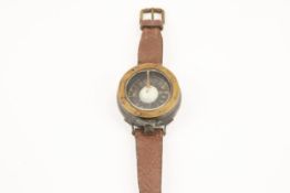 A WWI Royal Flying Corps brass wrist compass, the rim marked "Patt. 261, No 1241B/55", with