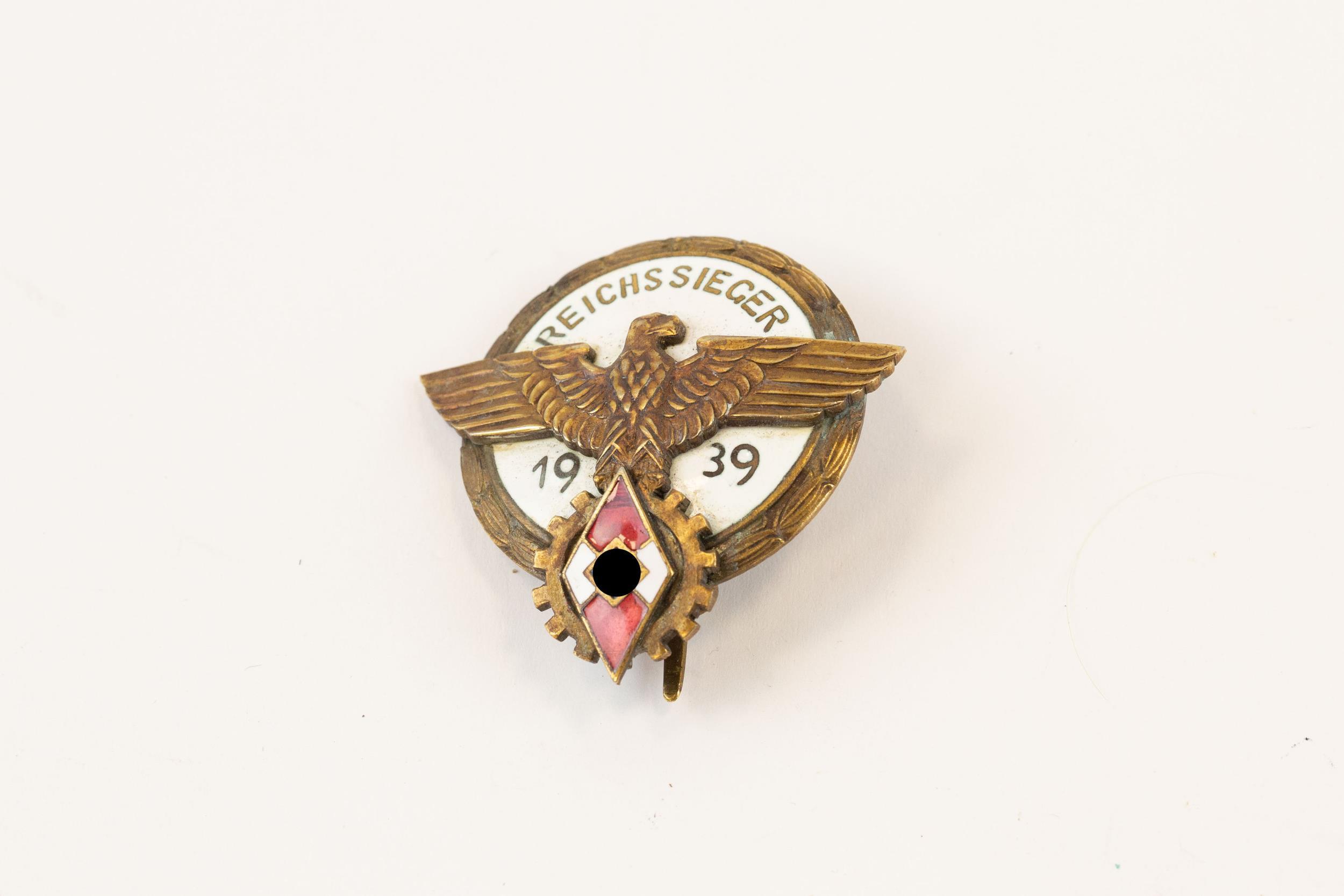 A Third Reich Hitler Youth 1939 Reichssieger pin back enamelled badge. GC £200-250