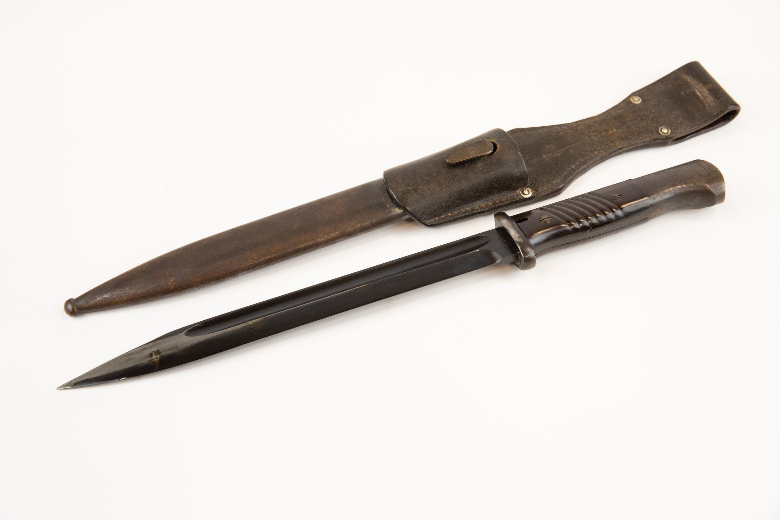 A WWII German K98 bayonet, with brown bakelite grips, in its scabbard with leather frog, the bayonet - Image 2 of 6