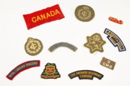 11 pre WWII/WWII Canadian cloth insignia, titles/trade badges and armband. £60-80