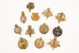 12 WWI period Corps cap badges: RFC officer's bronze, RFC OR's (2), Tank Corps, 16 spoke Army