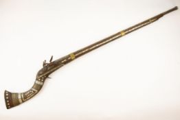 A decorative Indian tourist flintlock jezail, 50" overall, barrel 37", with very corroded EIC