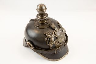 A WWI Wurttemberg Artillery Pickelhaube, with iron badge, ball top and mounts, and with chinstrap