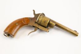 A late 19th century brass cigar cutter, in the form of a pin-fire revolver, 6½" overall, with