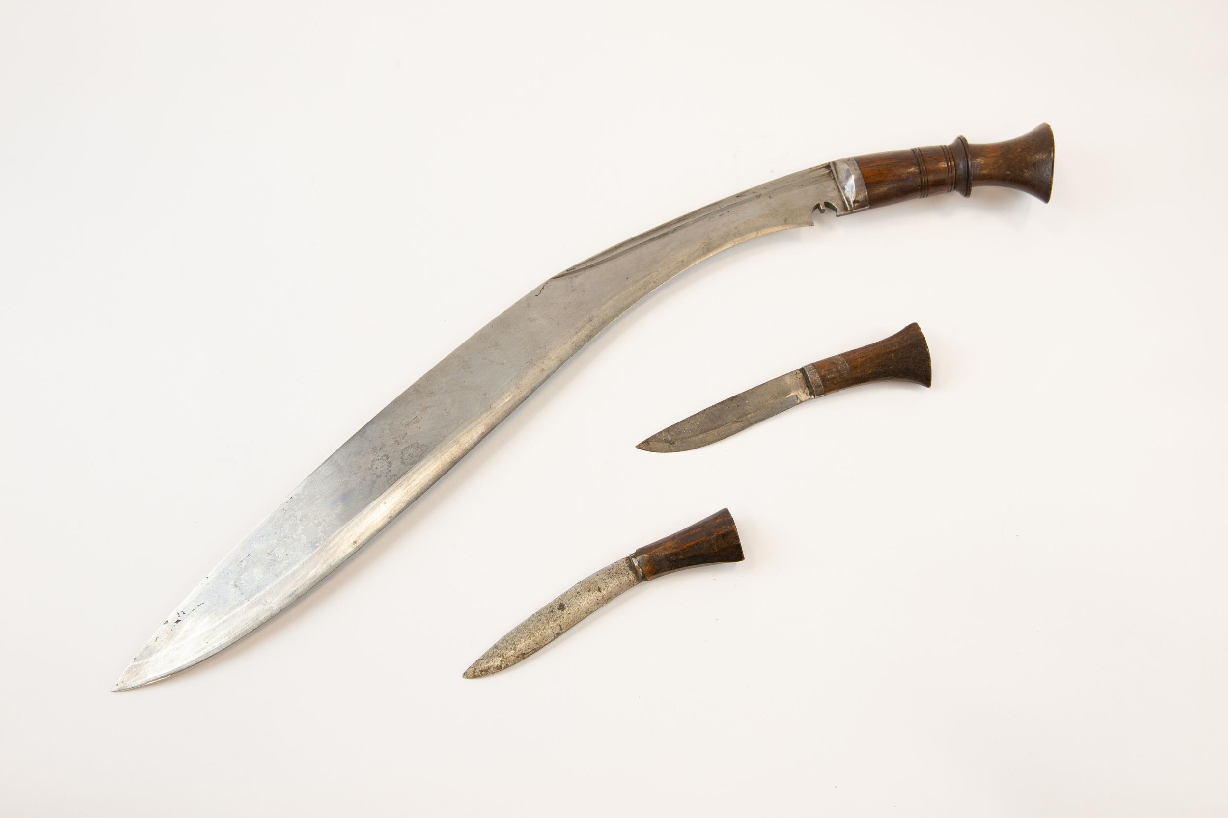 A good old large Kukri, blade 17½", in its leather scabbard complete with skinning knives. GC £60-70 - Image 2 of 2