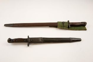 A 1907 SMLE bayonet, issue date "2 43", complete with frog; also a SMLE India pattern bayonet