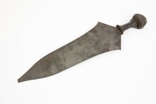 An African knife, probably from the Upper Congo, broad flat blade 16", the hilt with wooden grip and