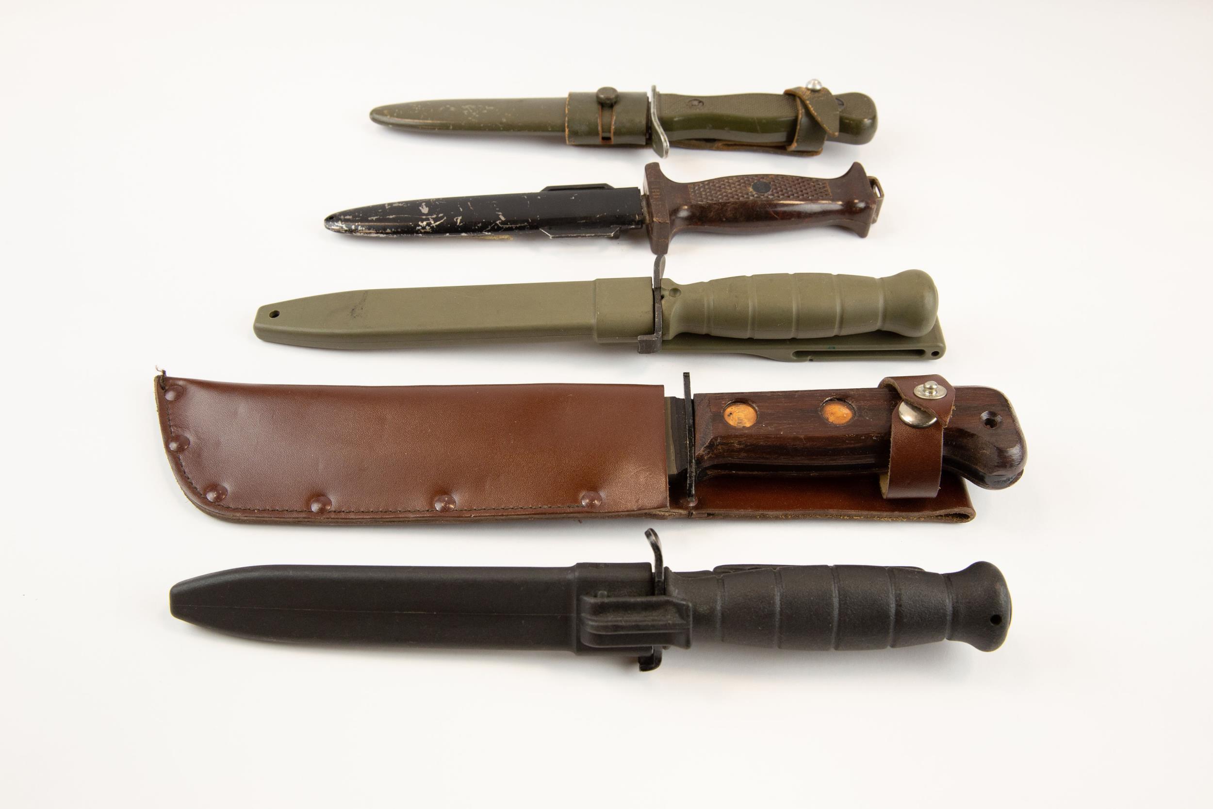 A Wilkinson survival knife c 1970, 2 German combat knives; 2 other Continental survival knives.