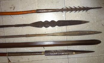 A Masai spear, the 31" parallel sided head of lozenge section; with 27" spike base, and short wooden