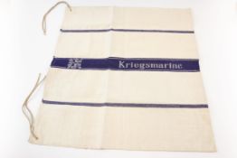 A German Kriegsmarine linen hand towel or cloth, 39" x 21", with blue "Kriegsmarine" band woven into