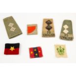 Selection of British Army Tropical/Indian rank slides and formation signs (7). £50-80