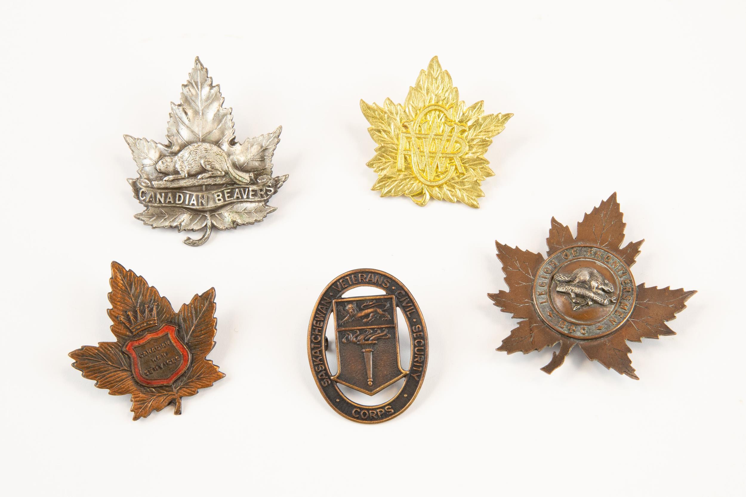 5 Canadian cap badges: Canadian Women's Volunteer Reserve Corps, silver "Canadian Beavers" type;