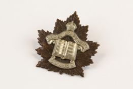 WWI CEF cap badge of the Khaki University of Canada. GC £80-150