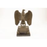 A large Third Reich bronzed brass standing eagle, on a rectangular base inscribed "Deutschland"