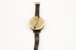 A scarce WWII German Luftwaffe pilot's wrist compass, of black bakelite and clear perspex, the