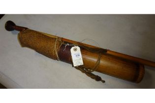 A Dyak blowpipe, together with an ornamental wooden dart quiver. GC £50-60