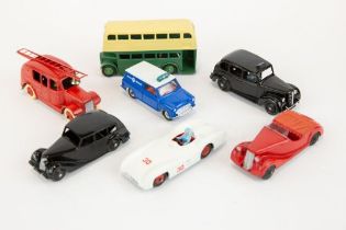 7 well restored early Dinky Toys. A Leyland Double Deck Bus, Austin FX3 TAXI, Streamlined Fire