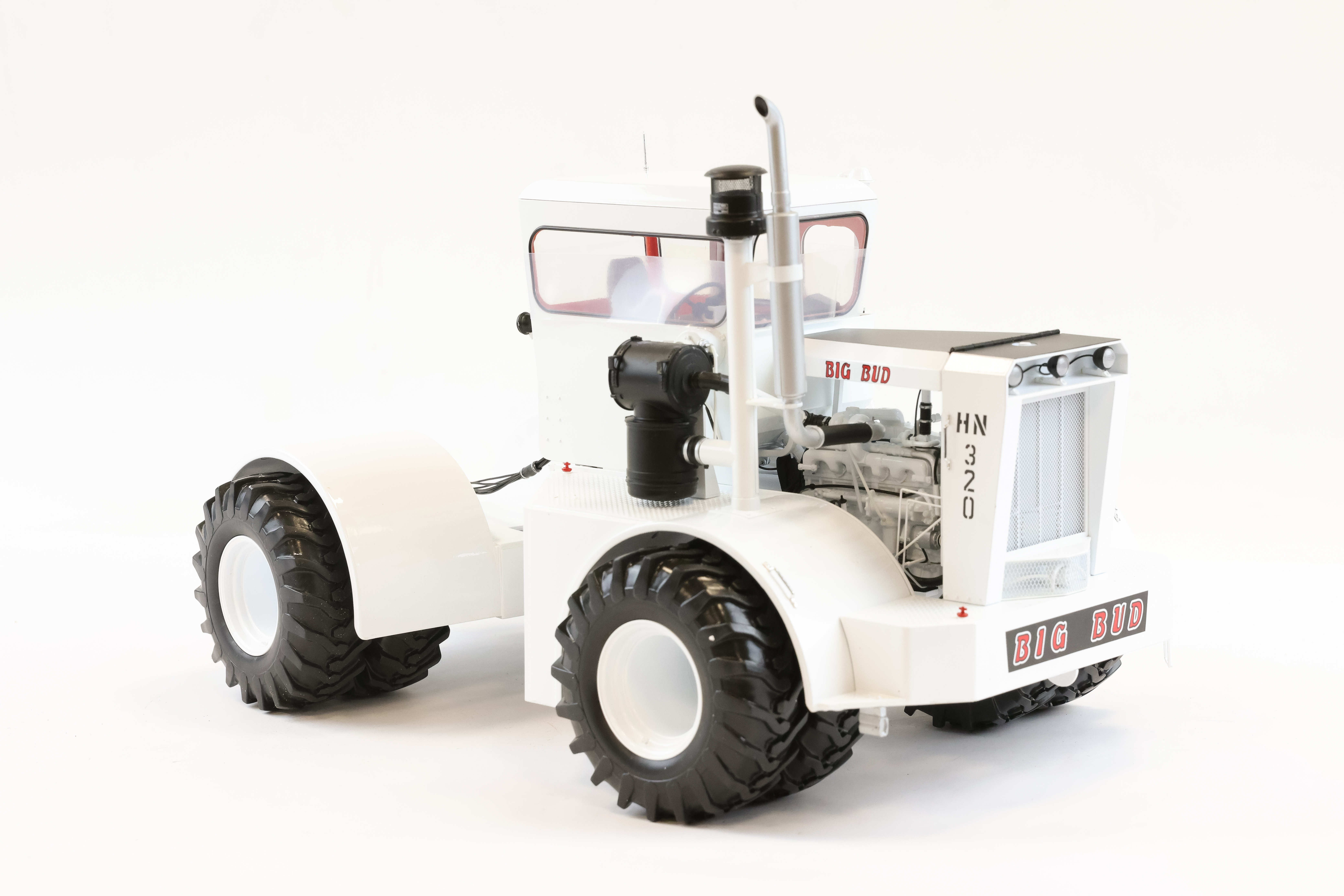An impressively large 1:16 scale Universal Hobbies American BIG BUD HN320 heavy duty Tractor.