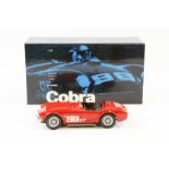 A Racing Legends 1:18 scale AC Ford Cobra 260 1962 American road racer. In red, racing number 98,