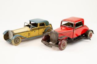 2 tinplate cars. A Wells Brimtoy Rolls Royce Coupe de Ville. In cream and blue livery with