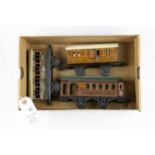 3 small German for the U.K. market tinplate 4 wheeled coaches. 2 by BING, a GWR 1st/3rd with opening