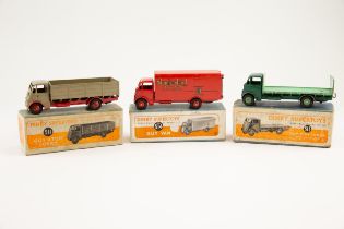 3 Dinky supertoys to include No.511 Guy 4-ton lorry with tan cab and red chassis, in a blue card box