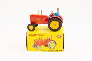 Dinky toys No.300 Massey Harris tractor. Bright red body, large diecast rear wheels with rubber