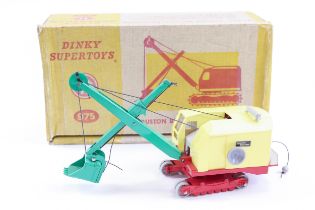 A Dinky Supertoys Ruston Bucyrus Excavator (975). Pale yellow plastic body, green jib and bucket,