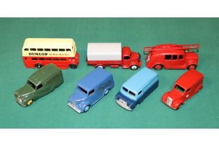 7 well restored Dinky Toys. Bedford 12CWT Van, Austin A40 Van, Delivery Van, Streamlined Fire Engine