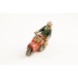 Tinplate Schuco clockwork powered Motorcycle. Length 13cm, Schuco Curvo 1000. In red with civilian