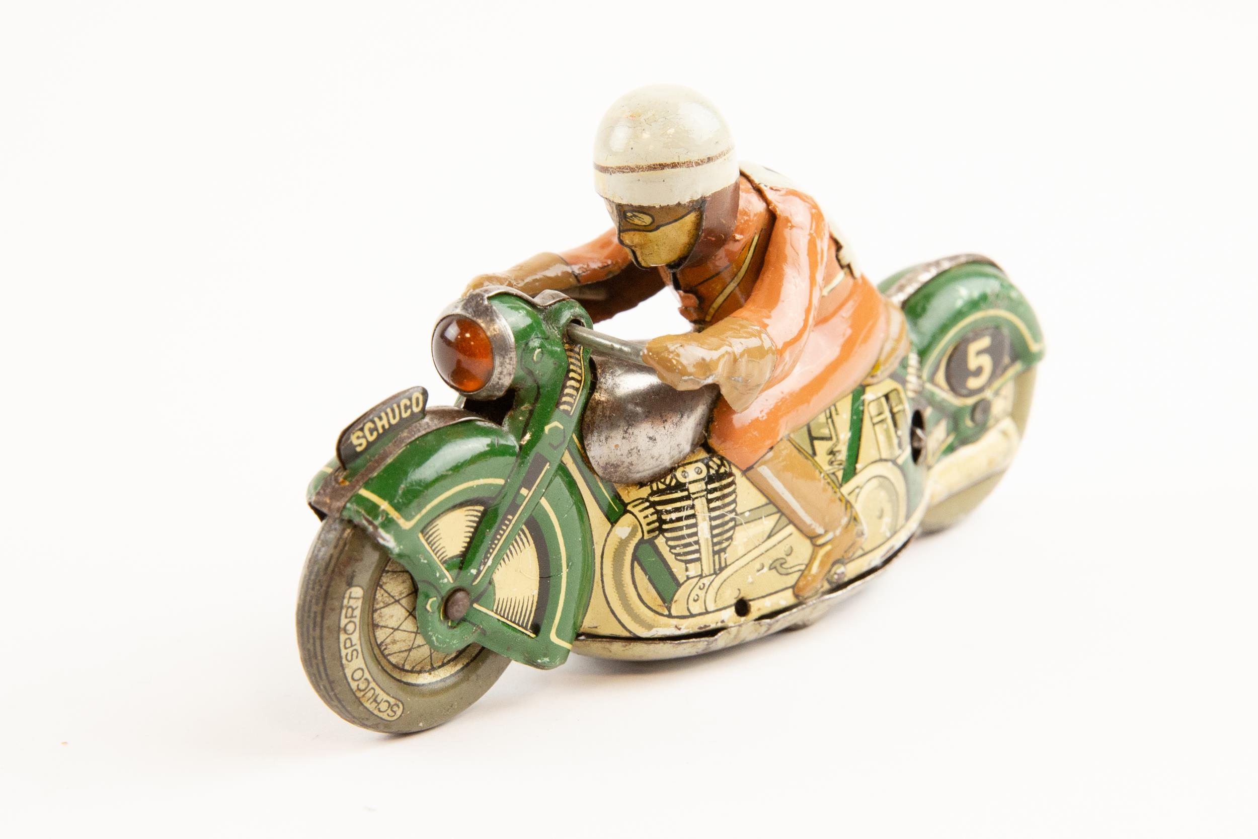 Tinplate Schuco clockwork powered Racing Motorcycle. Length 13cm, Schuco Sport, racing number 5.