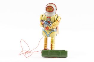 A scarce tin earth man robot toy dating from the 1950s by Nomura, made in Japan. Comes with