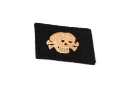 A Third Reich SS Man's worsted embroidered skull collar patch. £70-100