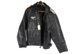 A Third Reich Luftwaffe officer's black leather flying jacket, with silver alloy embroidered eagle